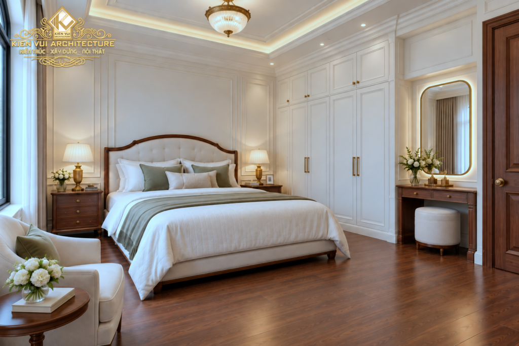 Phòng ngủ tông kem với giường viền gỗ, tủ áo trắng và bàn trang điểm