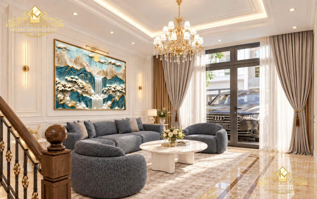 Phòng khách có sofa xám, tranh phong cảnh và cửa kính rèm hai lớp