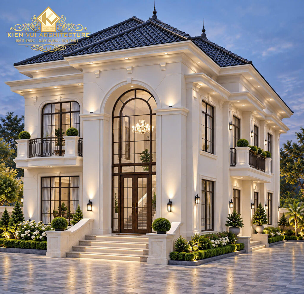 Góc nhìn nghiêng biệt thự tân cổ điển mái Nhật với ban công cong và hệ cửa vòm vào buổi tối