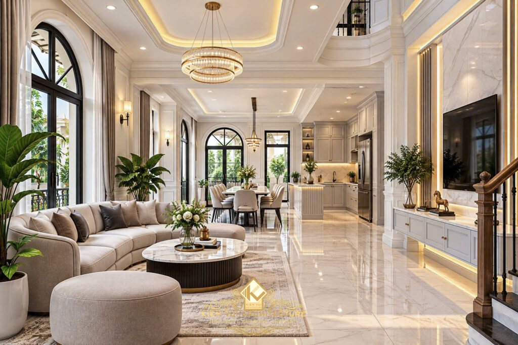 Phòng khách biệt thự với sofa kem, cửa vòm và tầm nhìn về khu bếp ăn
